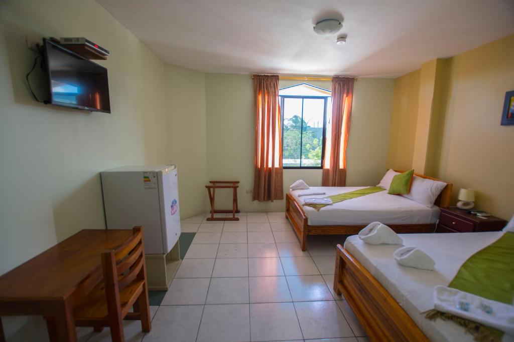 Postel nebo postele na pokoji v ubytování Hostal Andry