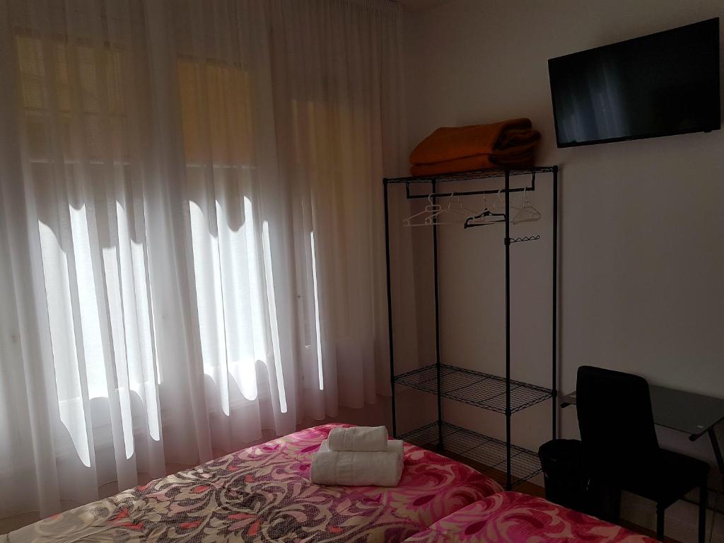 Cama o camas de una habitación en Pensión Sotelo