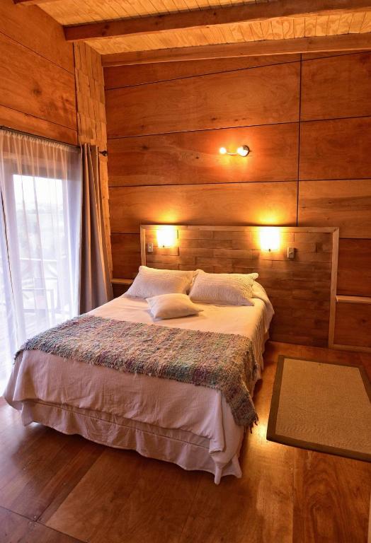 Postel nebo postele na pokoji v ubytování Hostal Boutique Los Arrayanes