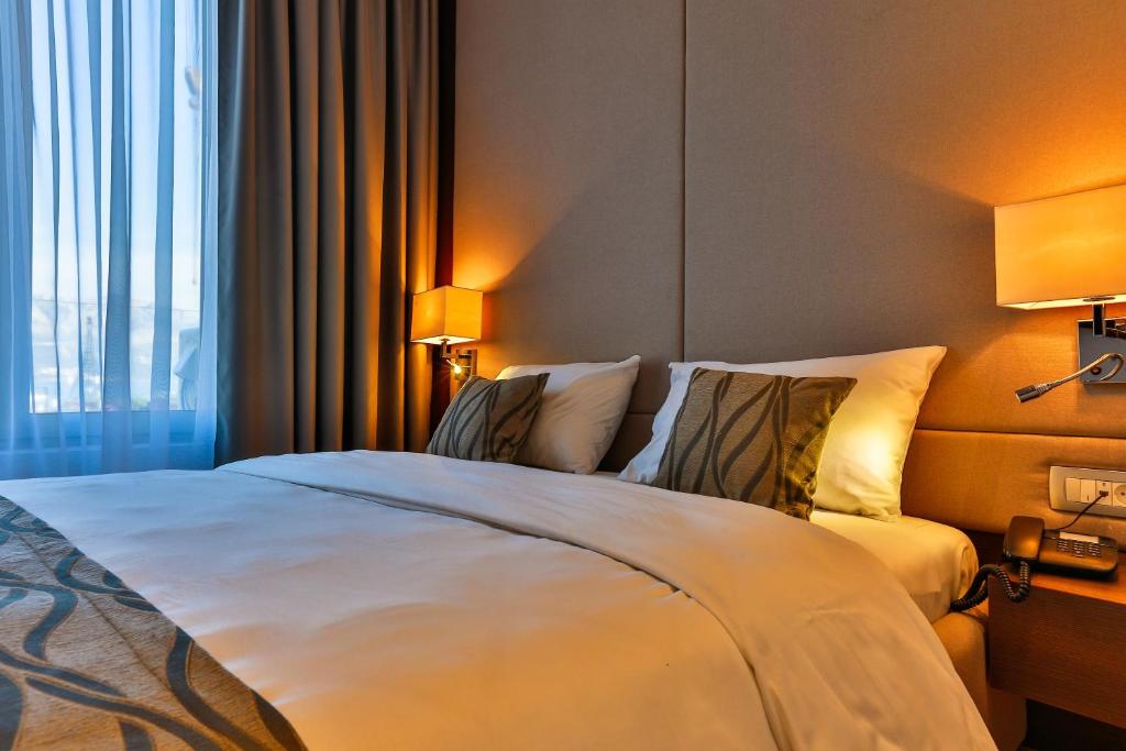 Postel nebo postele na pokoji v ubytování Hotel WOW