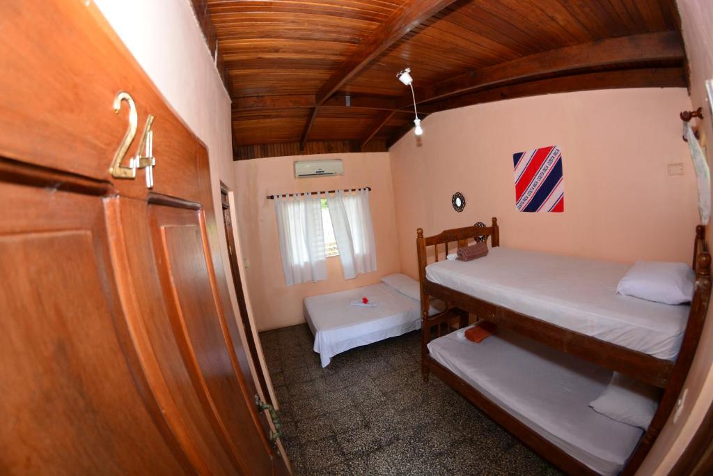 Postel nebo postele na pokoji v ubytování Tsunami Hostel