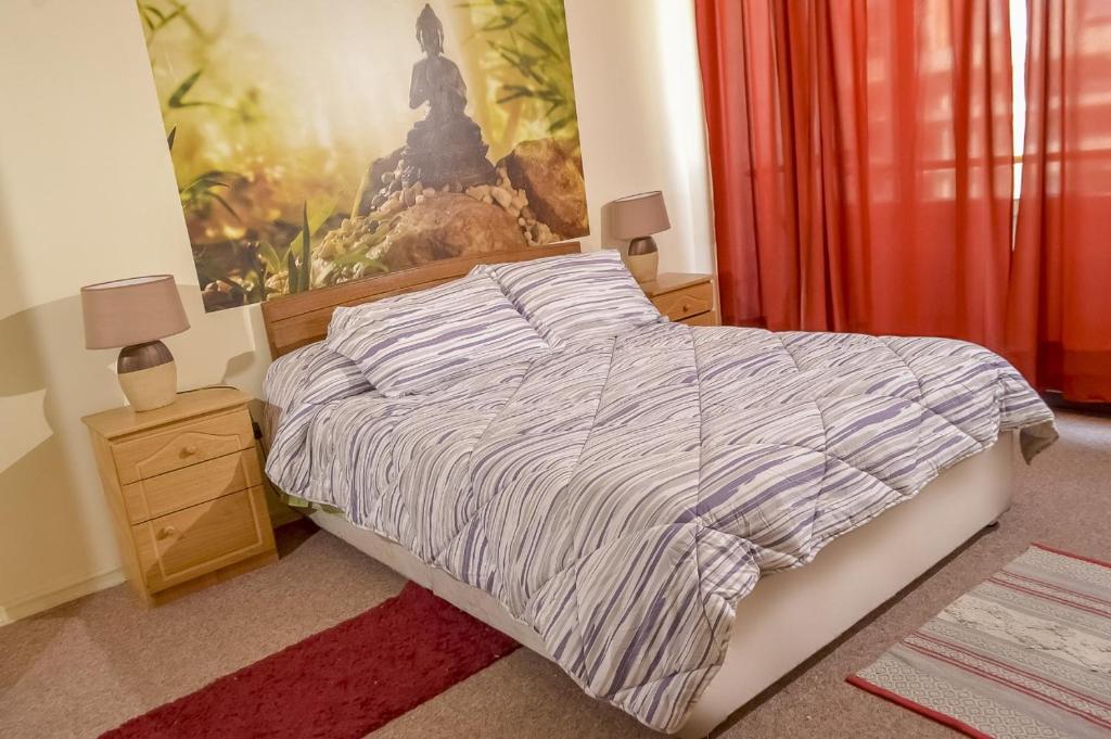 Postel nebo postele na pokoji v ubytování Departamentos Providencia J&M