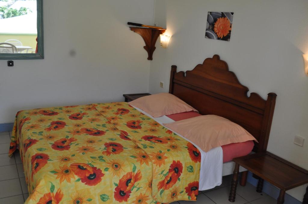 Postel nebo postele na pokoji v ubytování Appartement Hibiscus 2
