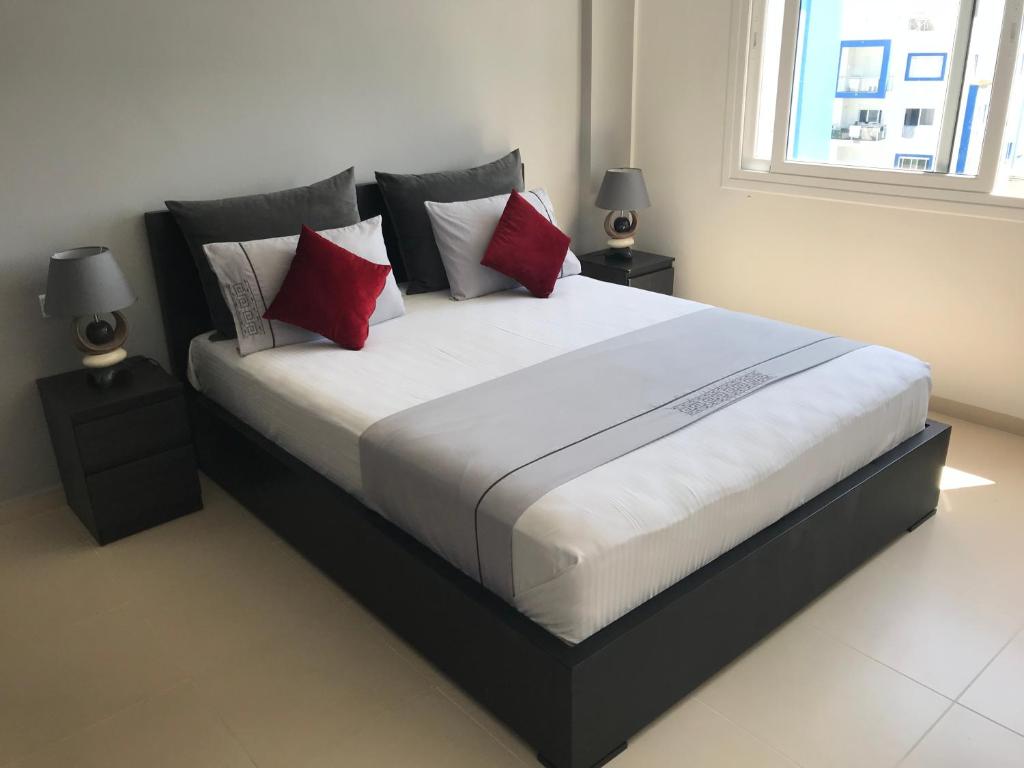 Postel nebo postele na pokoji v ubytování Residence cabo negro