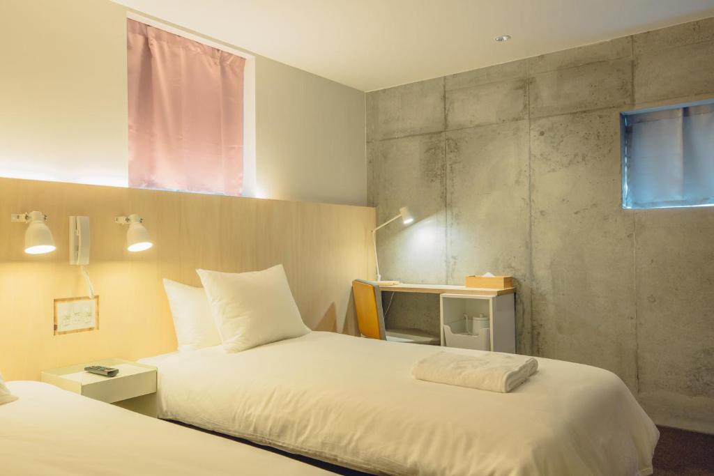 Postel nebo postele na pokoji v ubytování DOMO Hotel