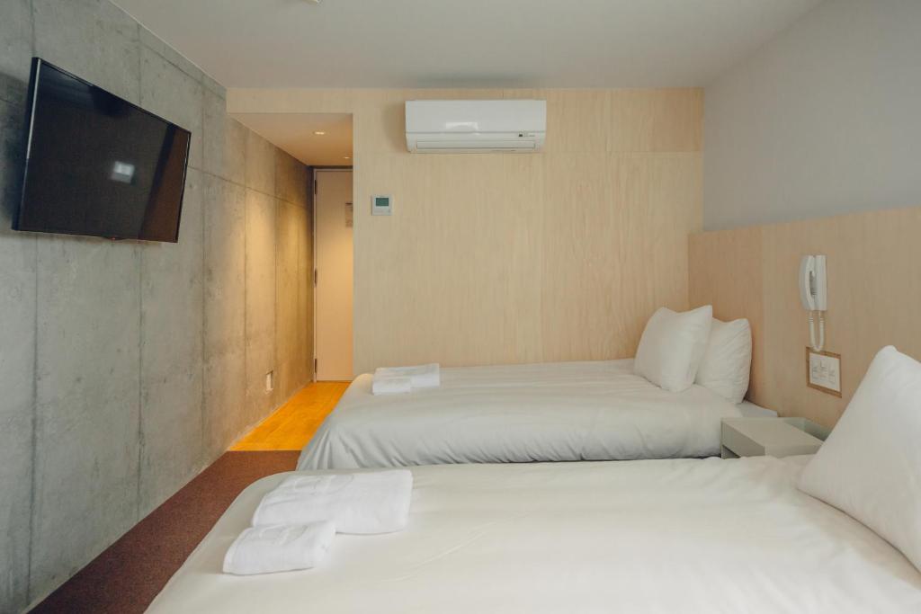 Postel nebo postele na pokoji v ubytování DOMO Hotel
