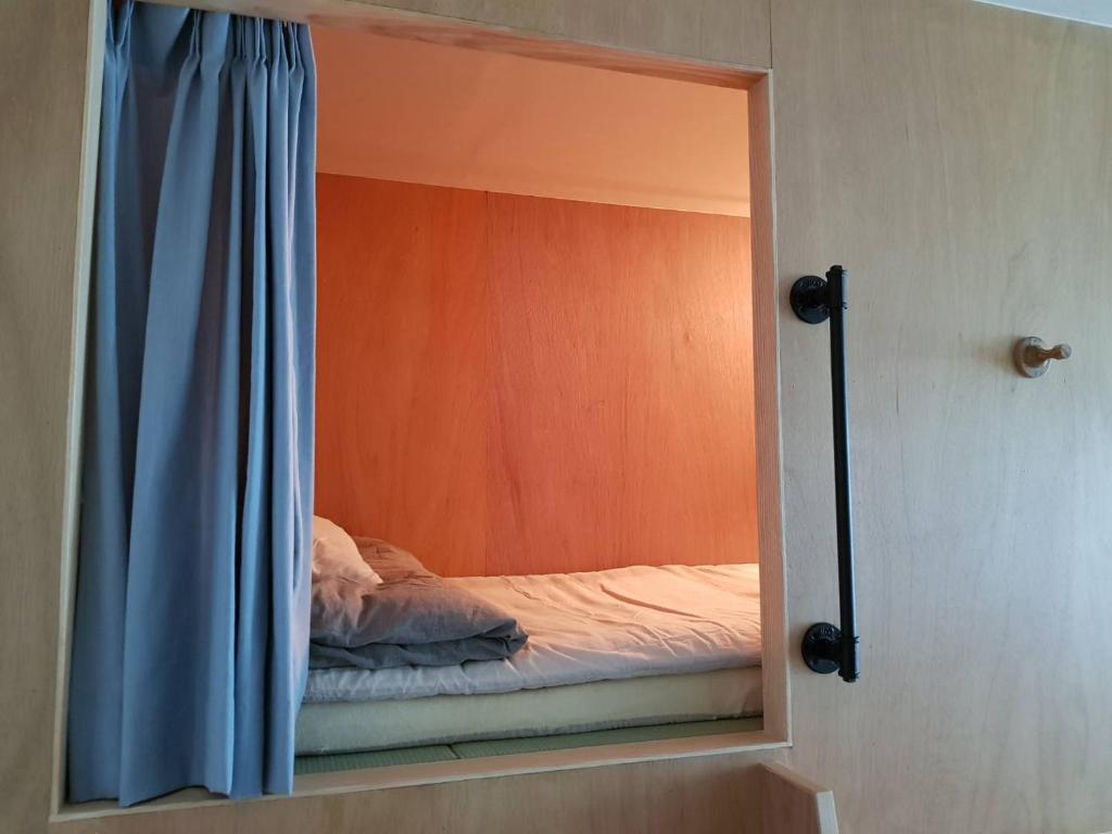 Postel nebo postele na pokoji v ubytování Sen Guesthouse