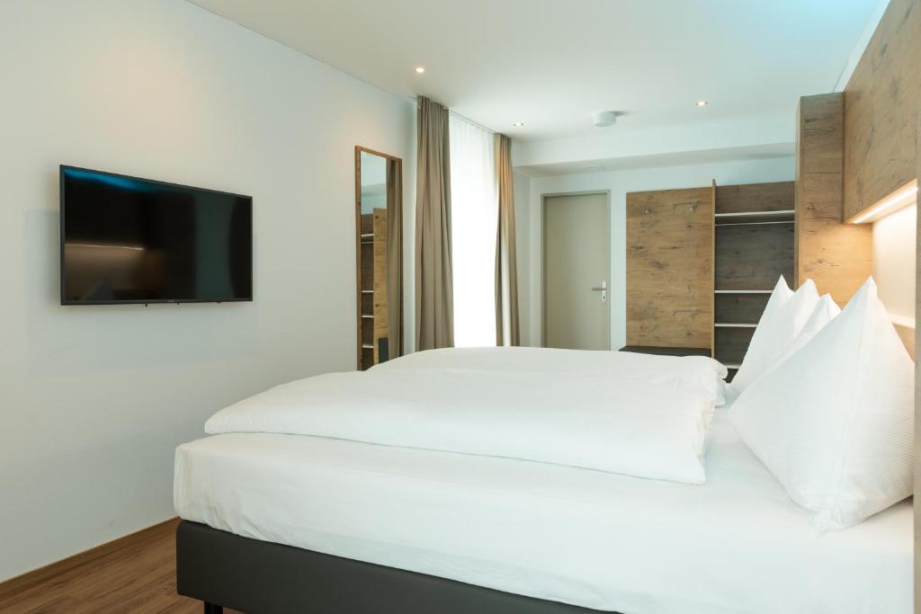 Postel nebo postele na pokoji v ubytování TRIP INN JET HOTEL Zürich Airport
