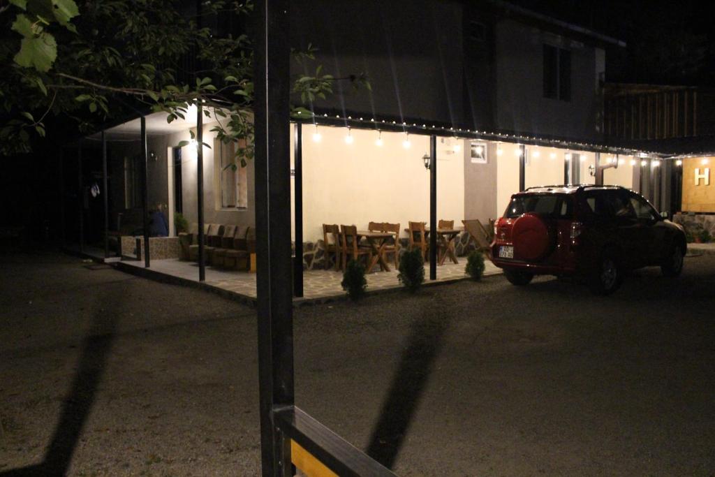 a car parked in front of a building at night at Guest House on Meskheti in Borjomi