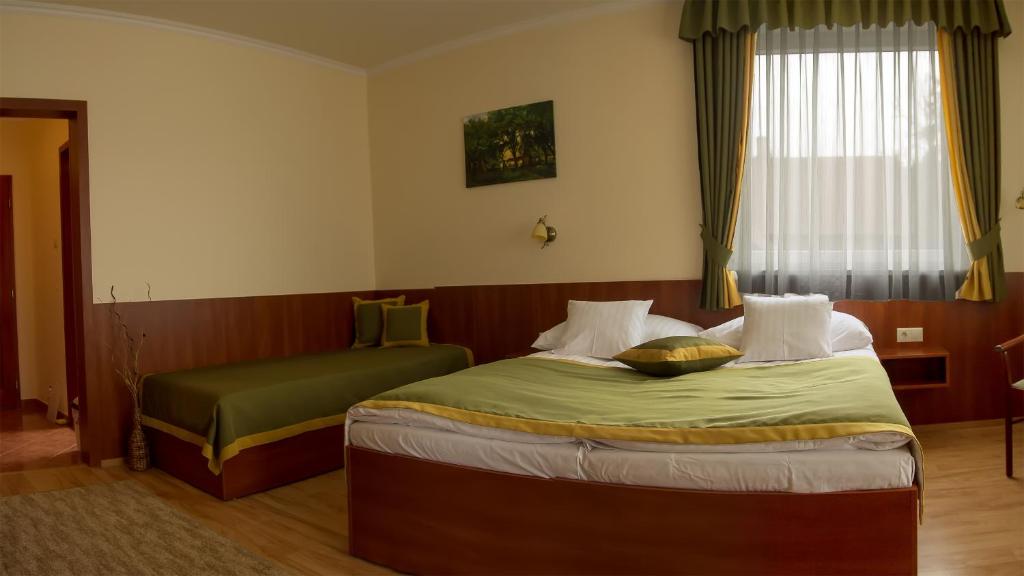 Postel nebo postele na pokoji v ubytování Apartman Bella Hotel