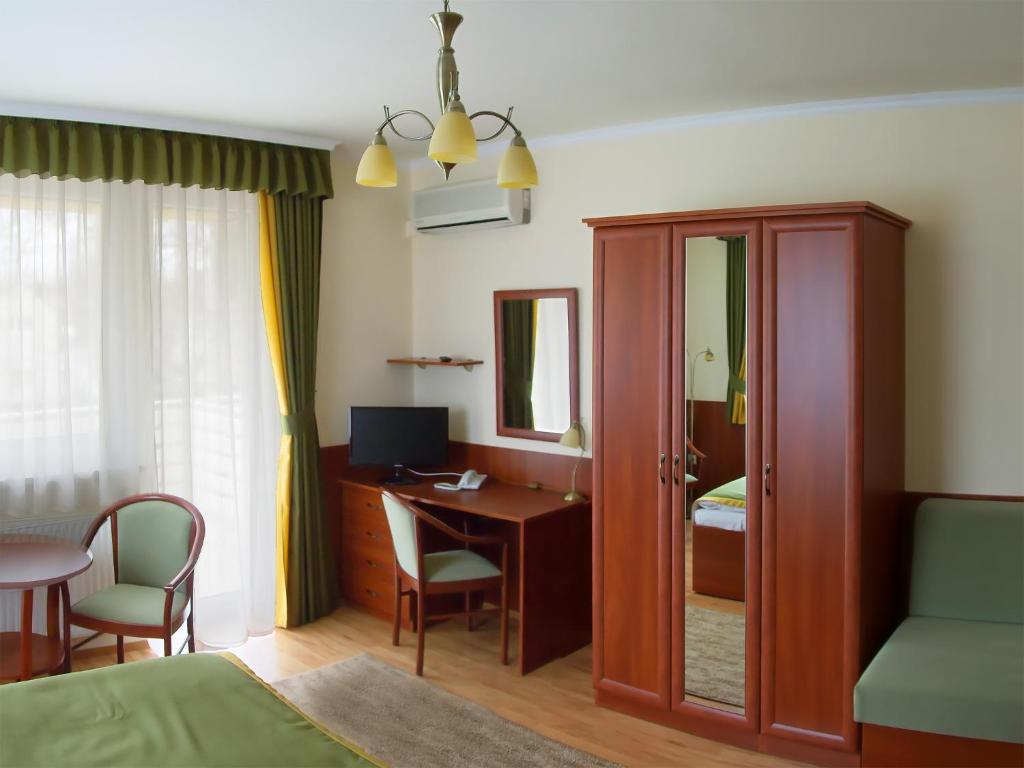 Postel nebo postele na pokoji v ubytování Apartman Bella Hotel