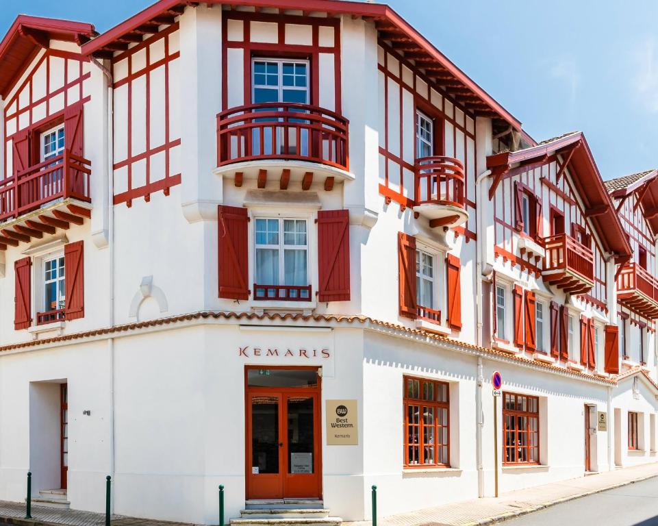 a large building with a large window on the side of it at Best Western Kemaris in Biarritz
