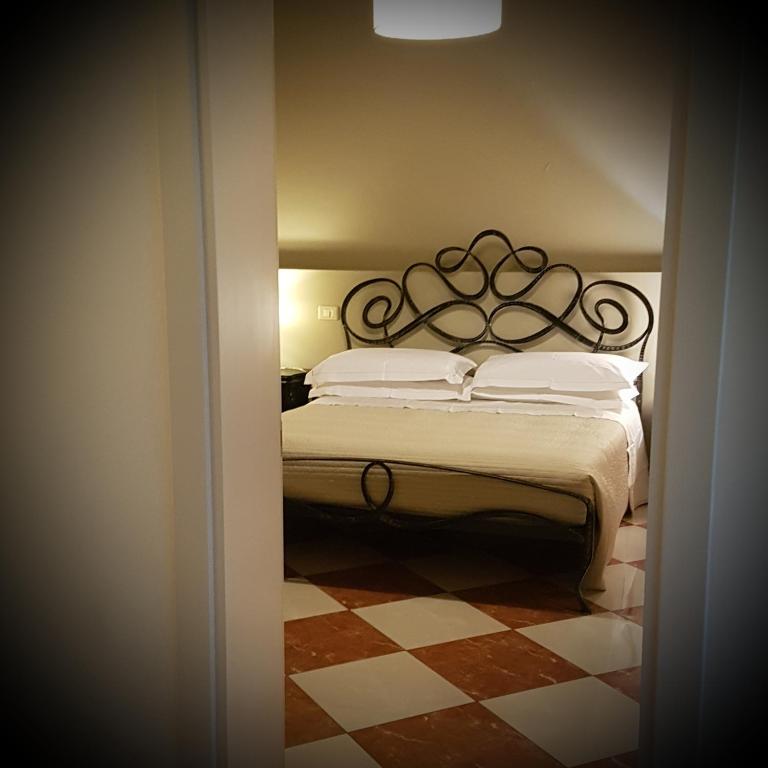 Postel nebo postele na pokoji v ubytování La Corte Dei Sogni B&B