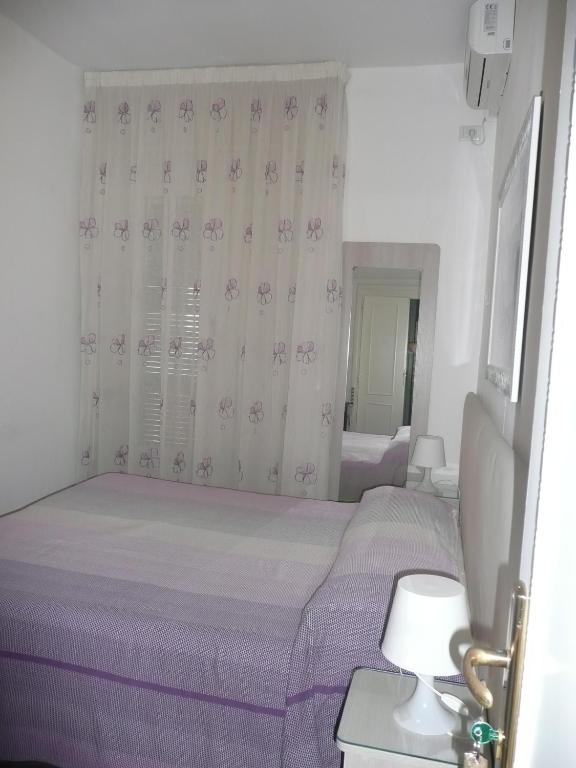 Postel nebo postele na pokoji v ubytování I Papiri B&B Aparthotel