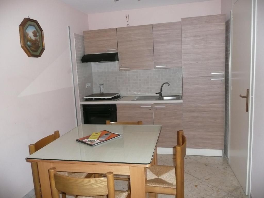 Kuchyň nebo kuchyňský kout v ubytování I Papiri B&B Aparthotel