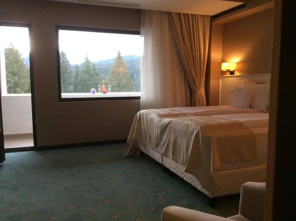 Un pat sau paturi într-o cameră la Hotel Hart