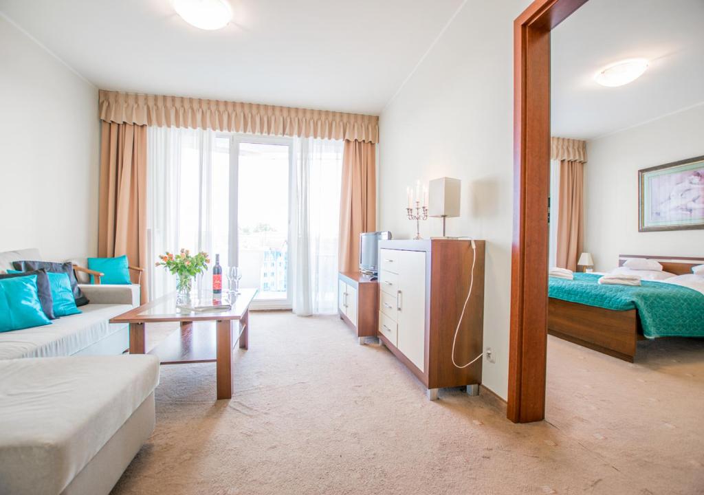 Ένα ή περισσότερα κρεβάτια σε δωμάτιο στο Senlux Apartments