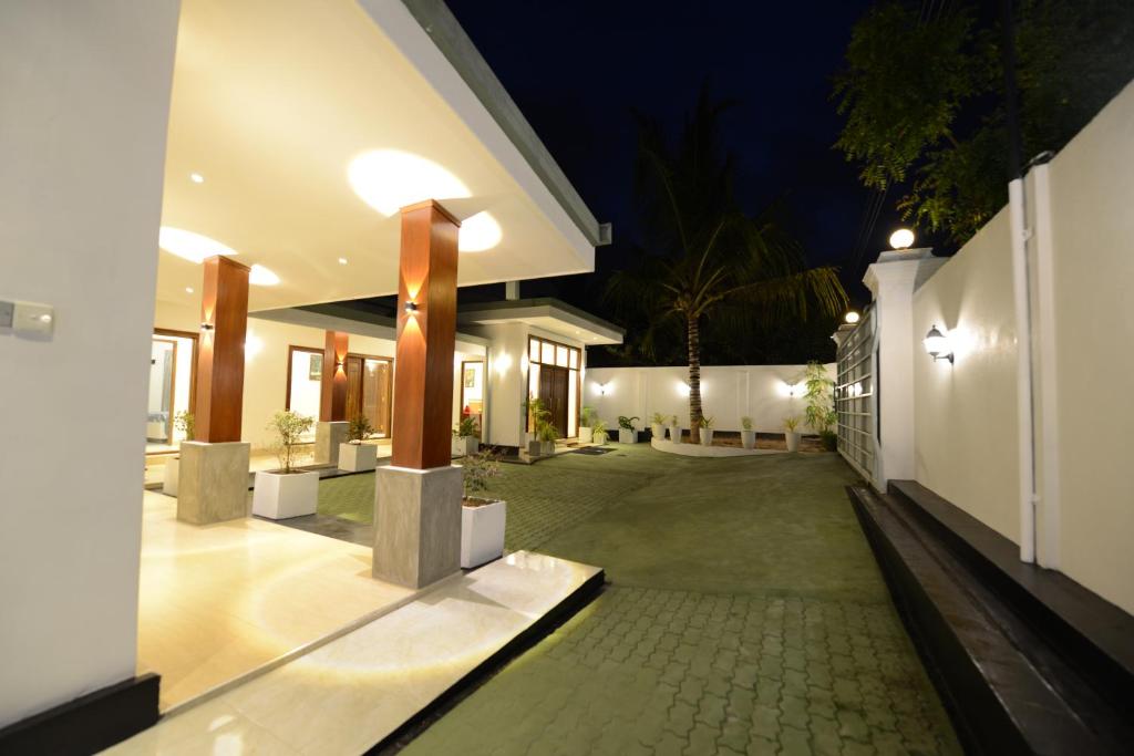 an empty courtyard of a house at night at Diva Villa Airport Transit Hotel in Katunayake