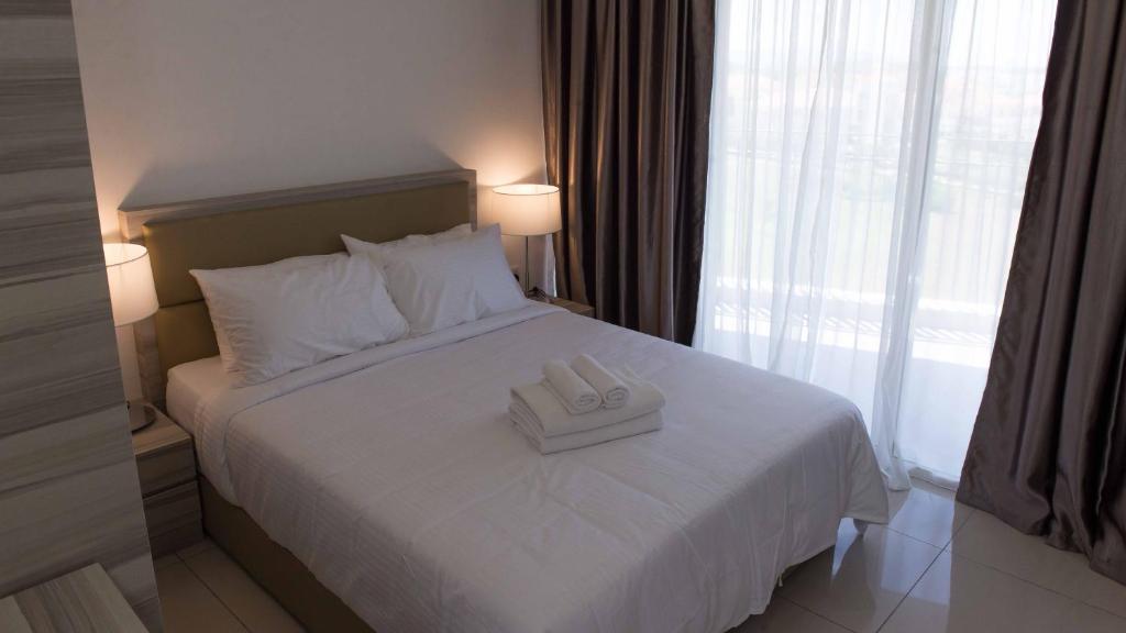 Postel nebo postele na pokoji v ubytování Encorp Marina Suites By Iconic Bliss