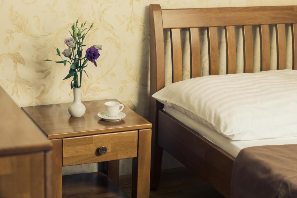 Postel nebo postele na pokoji v ubytování Premiere Hotel