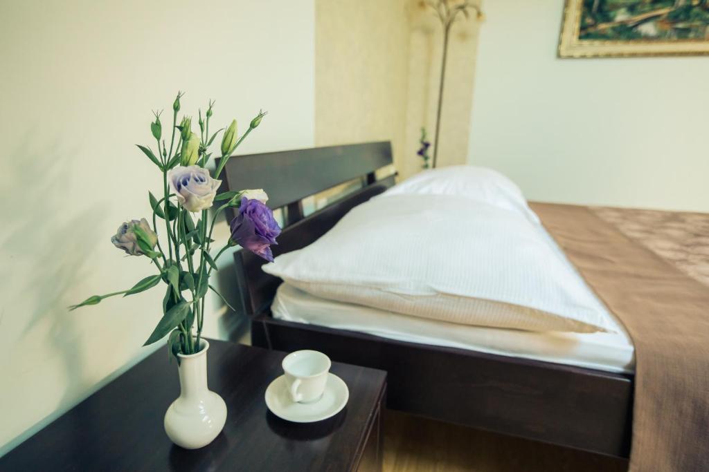 Postel nebo postele na pokoji v ubytování Premiere Hotel