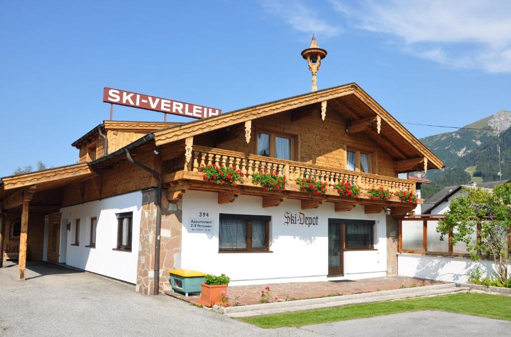 a building with a sign on top of it at Gästehaus "Ski-Depot" in Seefeld in Tirol