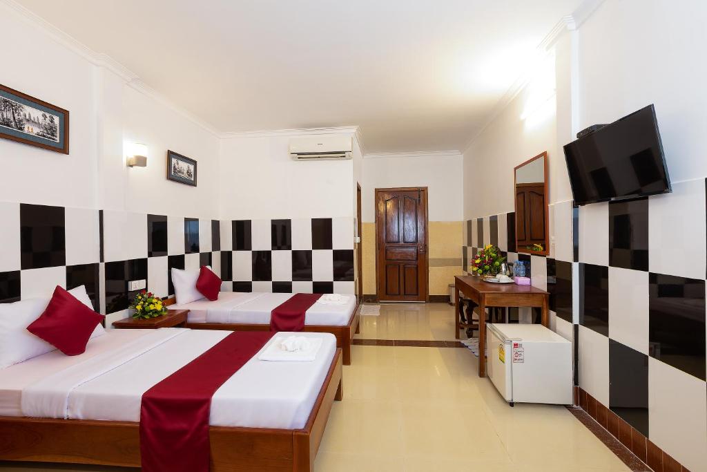 Ένα ή περισσότερα κρεβάτια σε δωμάτιο στο Botoum Hostel