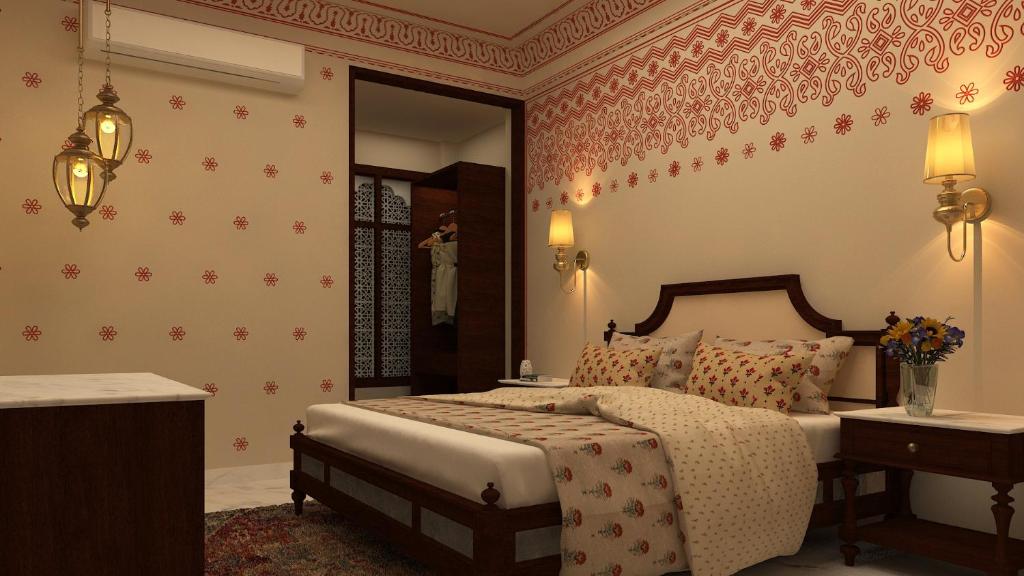 Postel nebo postele na pokoji v ubytování Laxmi Palace Heritage Boutique Hotel