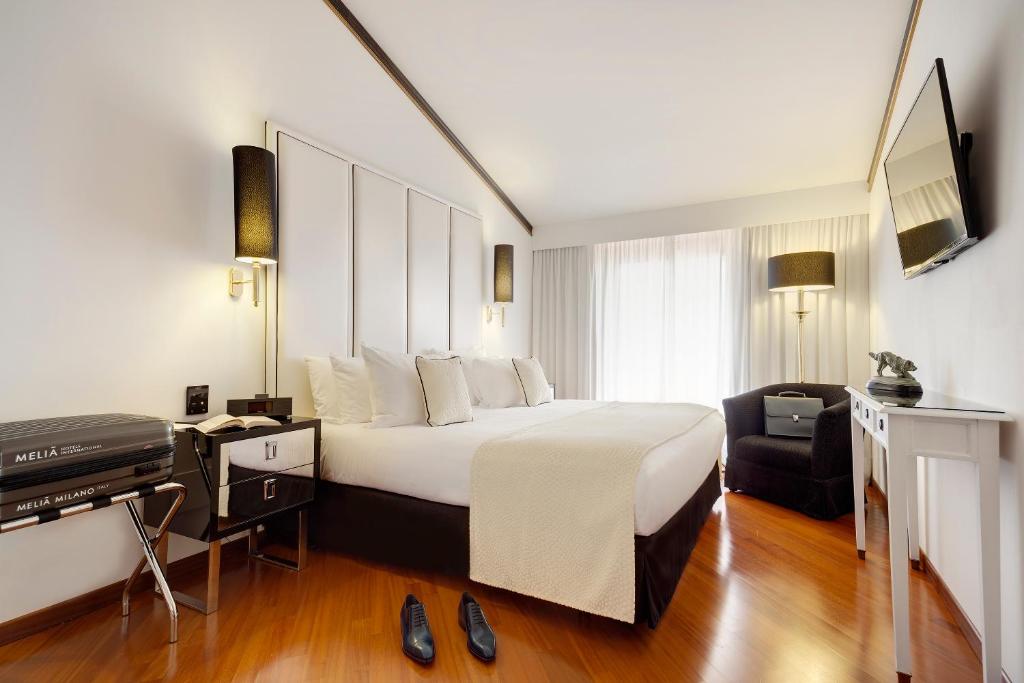 Кровать или кровати в номере Meliá Milano