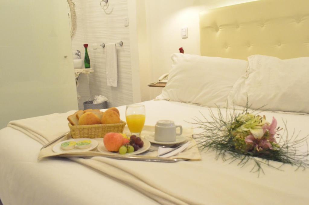 Postel nebo postele na pokoji v ubytování Hotel Inter Bogotá