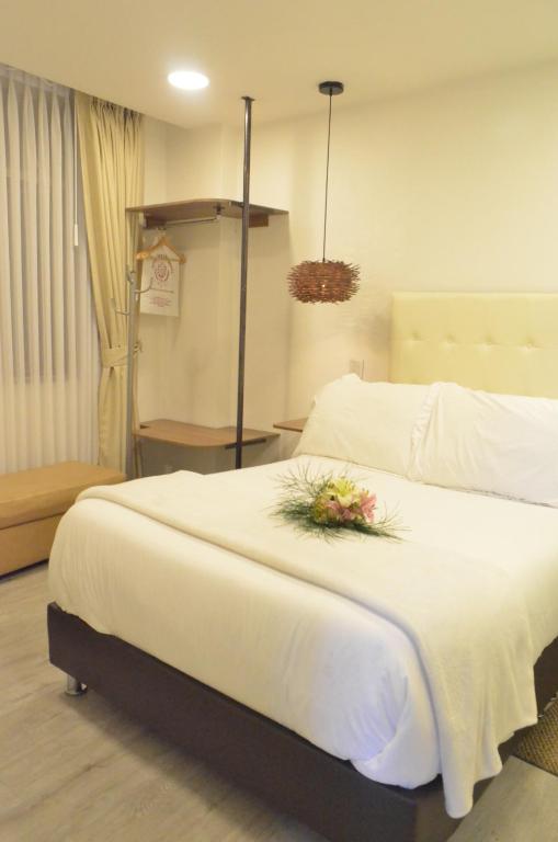 Postel nebo postele na pokoji v ubytování Hotel Inter Bogotá
