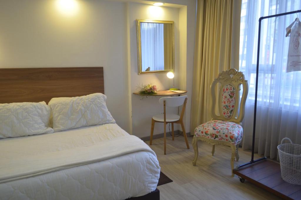 Postel nebo postele na pokoji v ubytování Hotel Inter Bogotá
