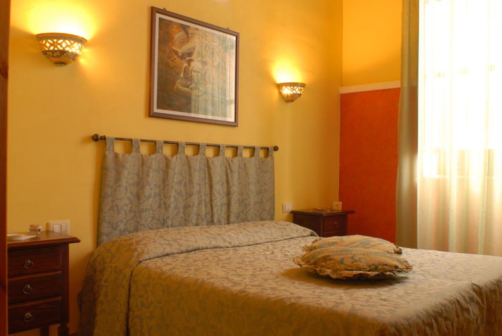 Postel nebo postele na pokoji v ubytování B&B Triskèles