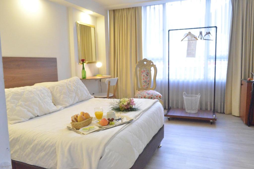 Postel nebo postele na pokoji v ubytování Hotel Inter Bogotá