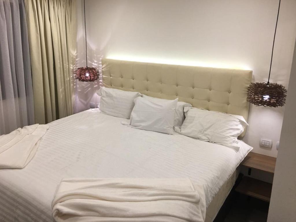 Postel nebo postele na pokoji v ubytování Hotel Inter Bogotá