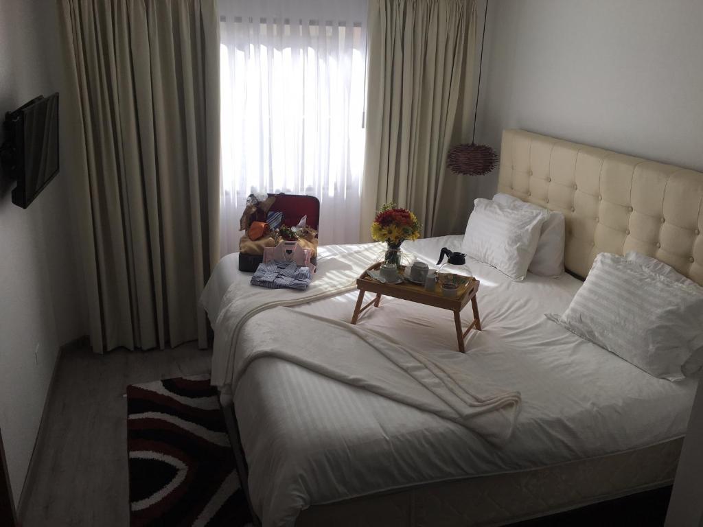 Postel nebo postele na pokoji v ubytování Hotel Inter Bogotá
