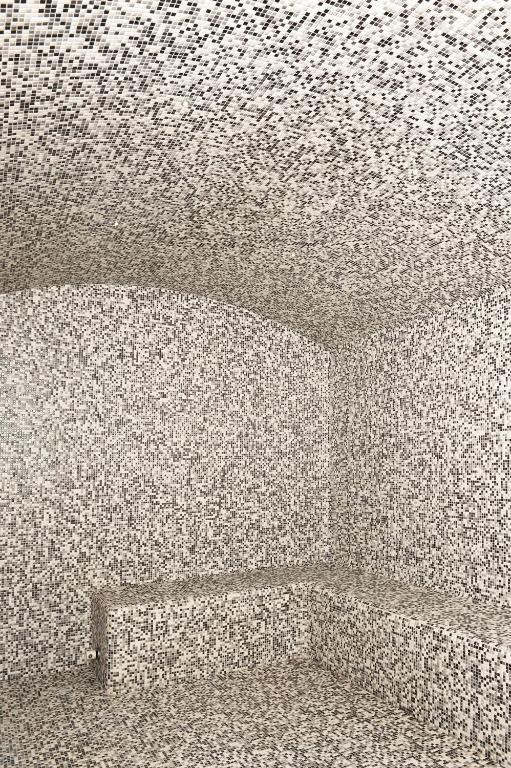 a ceiling of a room with a stone wall at Best Western Plus Hostellerie Du Vallon in Trouville-sur-Mer