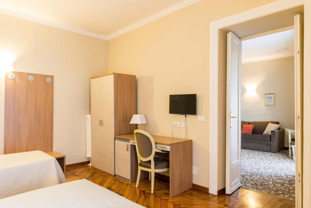 Cama o camas de una habitación en Hotel Alpi Resort