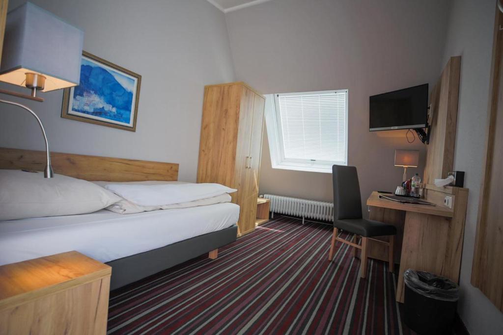 Postel nebo postele na pokoji v ubytování Hotel Süderelbe