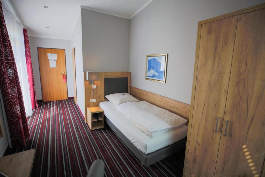 Postel nebo postele na pokoji v ubytování Hotel Süderelbe