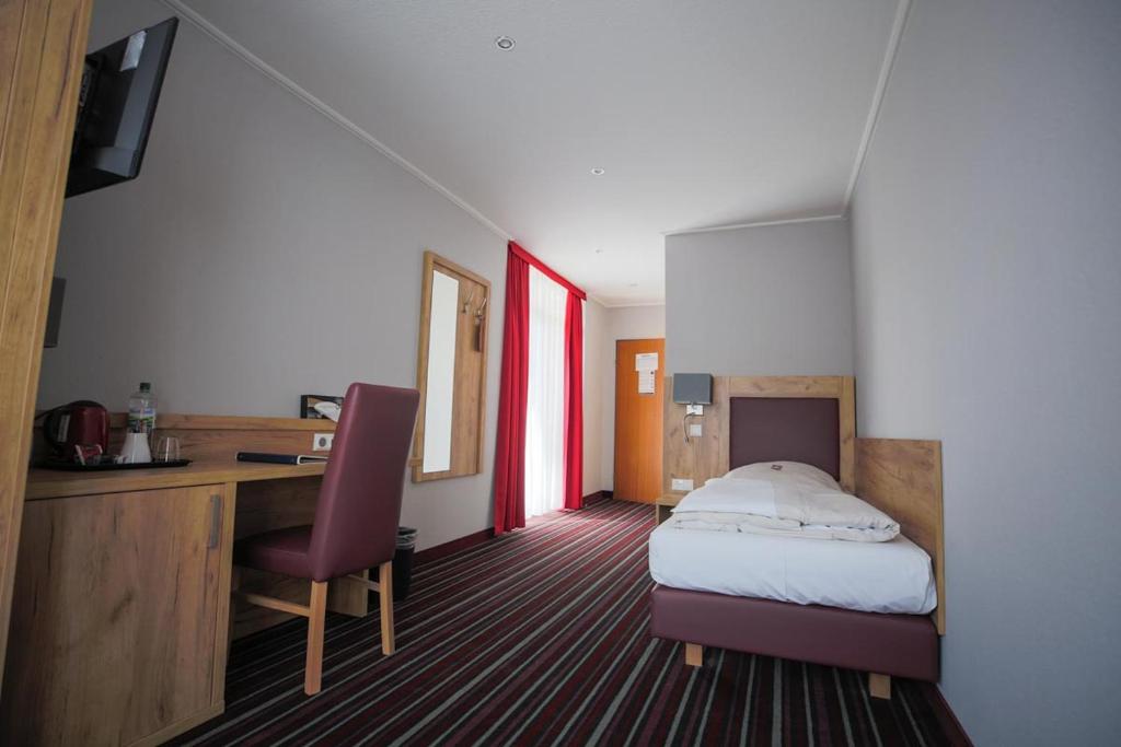 Postel nebo postele na pokoji v ubytování Hotel Süderelbe