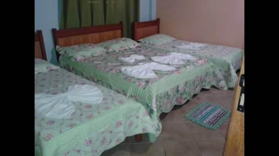 Cama ou camas em um quarto em Pousada Oasis