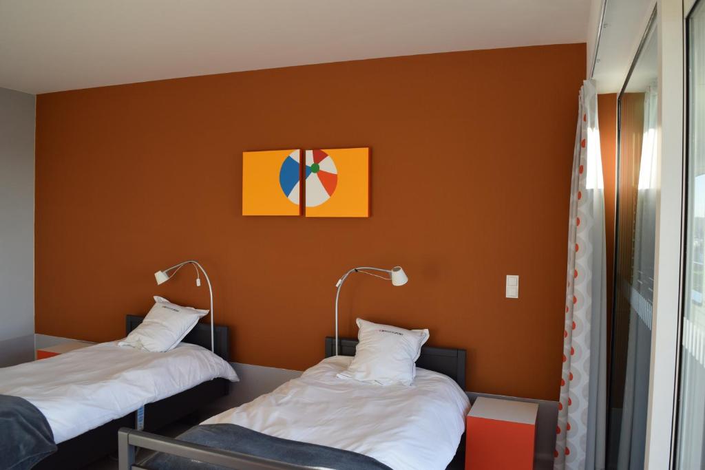 Postel nebo postele na pokoji v ubytování Hotel Middelpunt - Gratis Parking - Ontbijt inbegrepen!