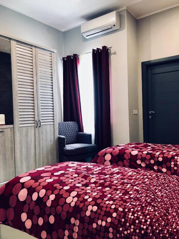 Postel nebo postele na pokoji v ubytování Holiday townhouse in Sliema centre