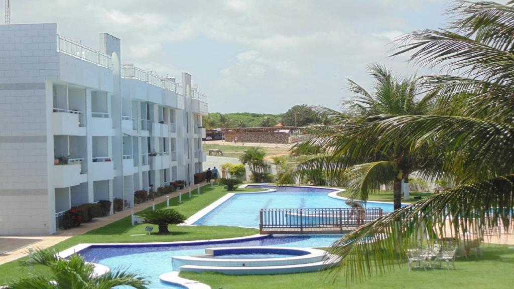  Sonia Flats - Apartamento térreo em condominio em frente à Praia de Camurupim