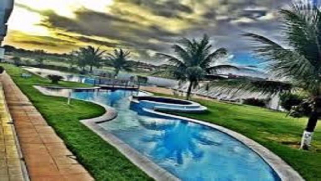  Sonia Flats - Apartamento térreo em condominio em frente à Praia de Camurupim
