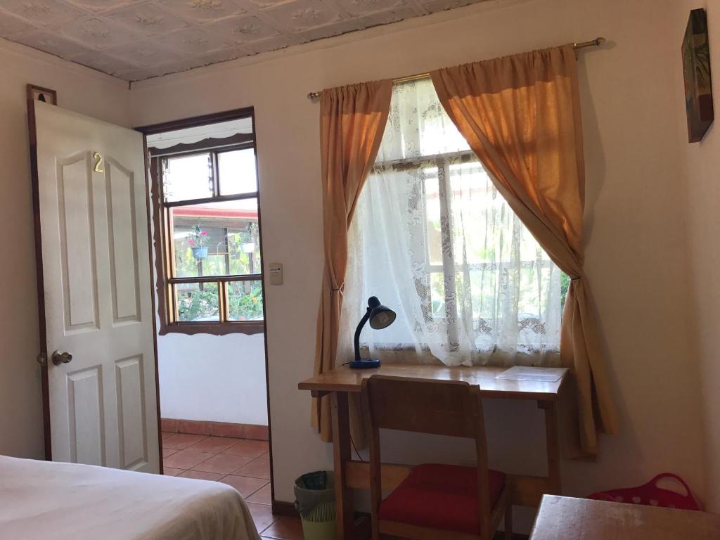 Postel nebo postele na pokoji v ubytování Casa Kibi Kibi