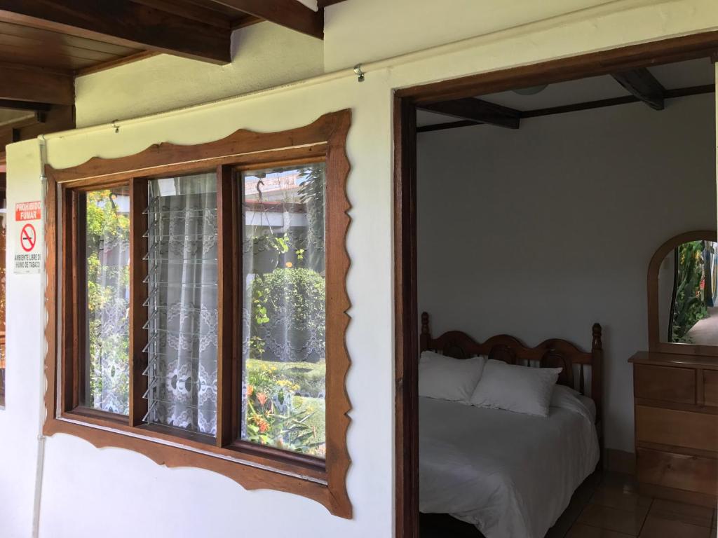 Postel nebo postele na pokoji v ubytování Casa Kibi Kibi