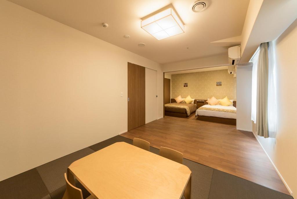 Postel nebo postele na pokoji v ubytování SARASA HOTEL Shin-Osaka