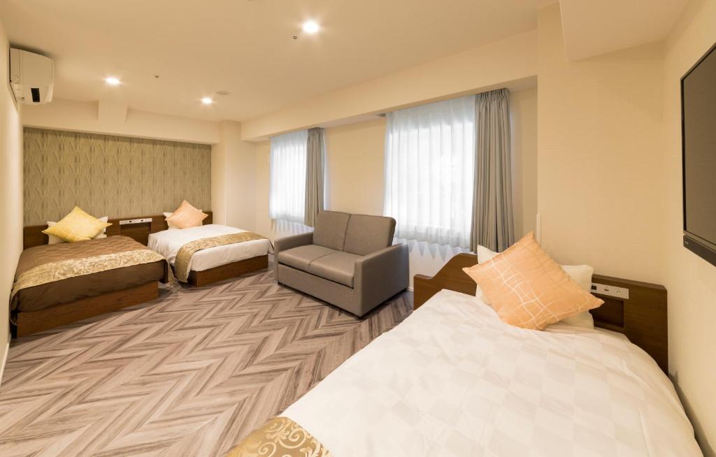 Postel nebo postele na pokoji v ubytování SARASA HOTEL Shin-Osaka